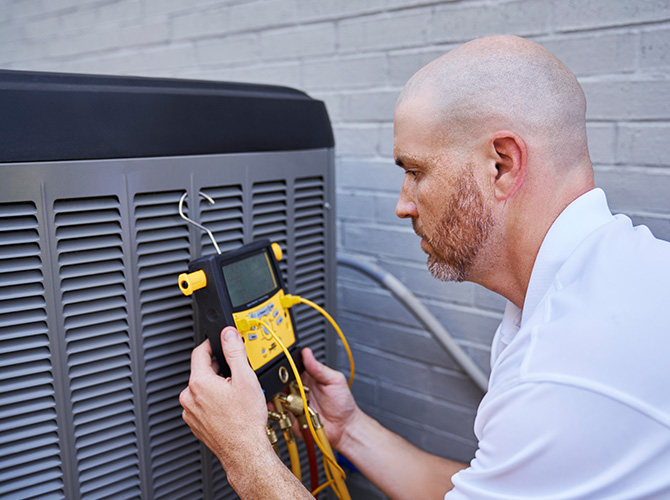 Technician performing HVAC installation